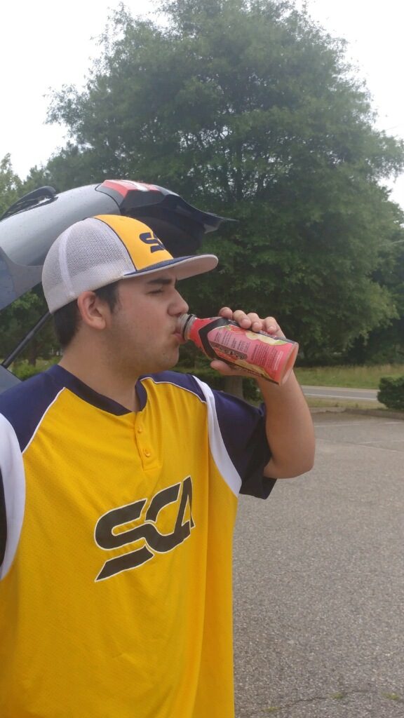Aiden enjoying his UNDERARMOR sport drink after batting practice